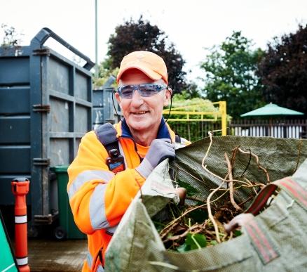 Ioannis carrying green waste at Kings Road Recycling Centre 